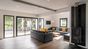 sala-comune-stufa-tv-divani-surf-camp-francia